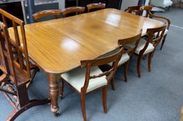 An early Victorian mahogany rectangular extending dining table, length 220cm extended, three spare