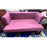 A contemporary Ambience settee upholstered in a plum fabric on square tapered legs, length 150cm,