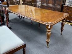 An early Victorian mahogany extending dining table on fluted baluster legs with two leaves, 240cm