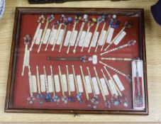 A cased collection of 19th century inscribed bone and glass bead lace bobbins, some dated and