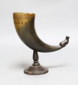 A Persian horn rhyton, 19th century or earlier, with horn stem and stepped wood base, 21cms high,
