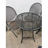 A Kettler circular garden table, diameter 62cm, height 72cm and two chairs