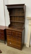 An 18th century oak chest of drawers with later associated oak shelves, width 79cm, depth 46cm,