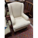 A modern Wesley-Barrell upholstered armchair