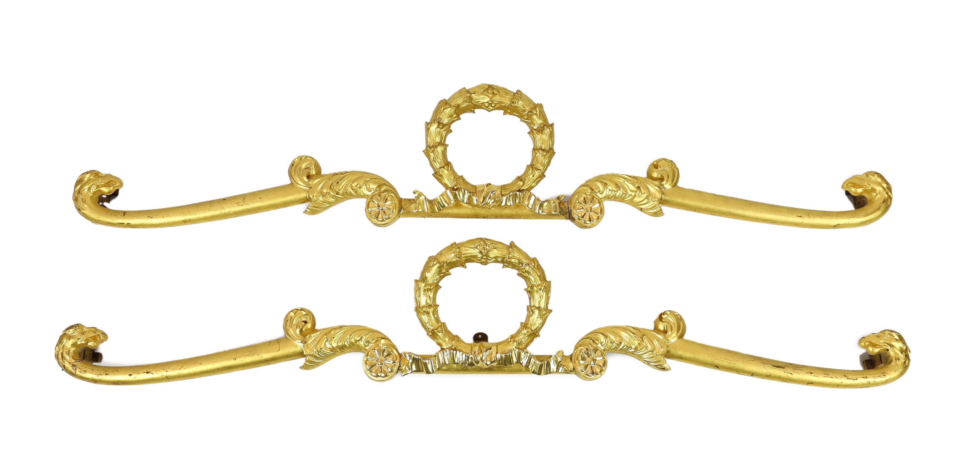 A pair of mid 19th century giltwood pediments, of laurel wreath ribbon and scroll form with eagles