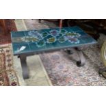 A 1970's wrought iron tile top coffee table, length 90cm, depth 45m, height 42cm