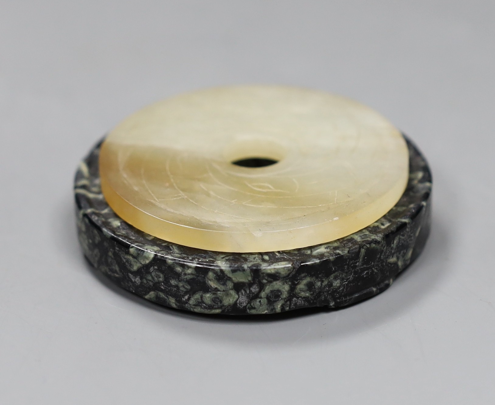 Two Chinese bi discs; in bowenite jade and black and green hardstone, largest 7cm diameter - Image 2 of 4