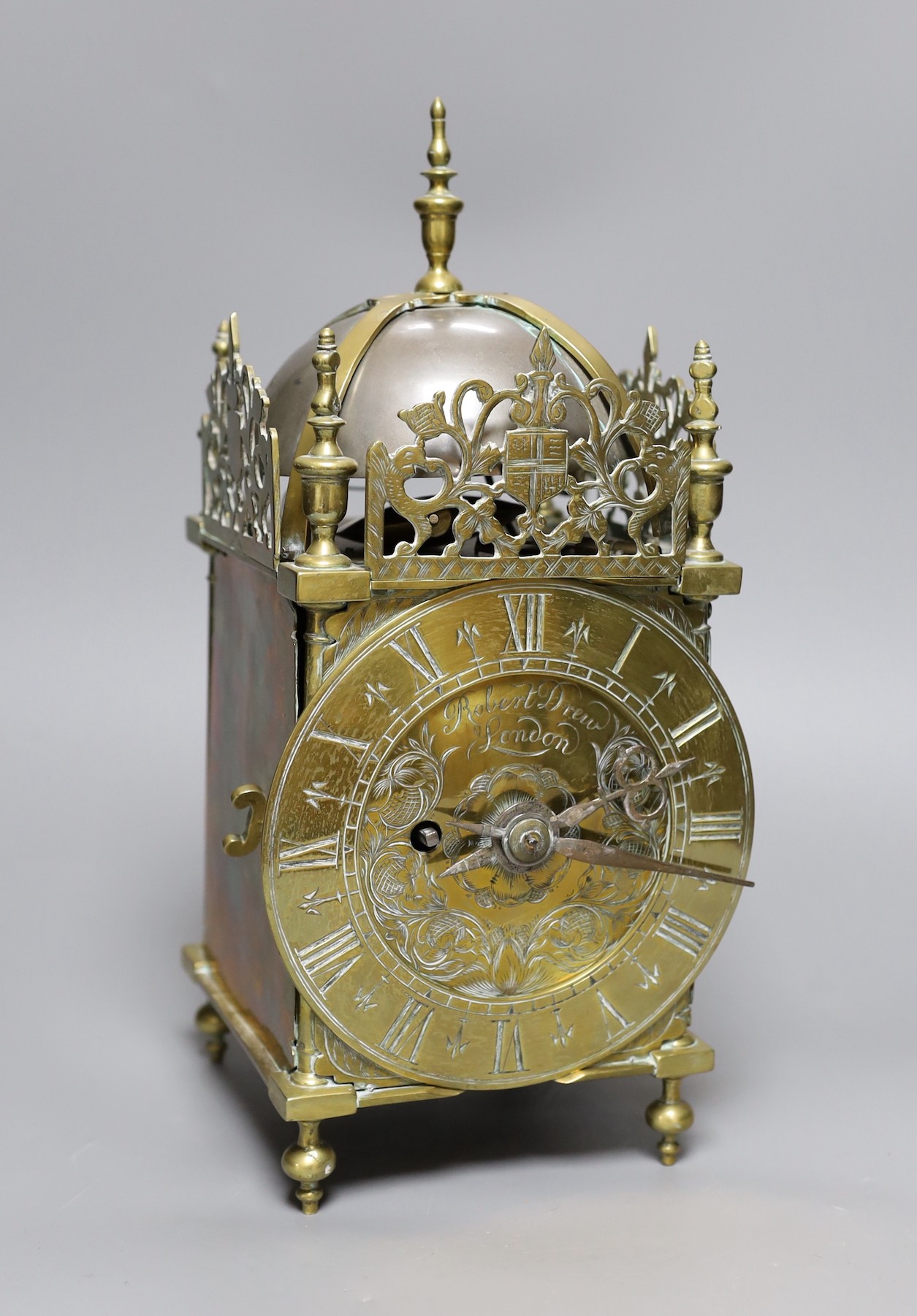 A brass lantern clock, signed Robert Drew, London, single fusee movement,34 cms high,