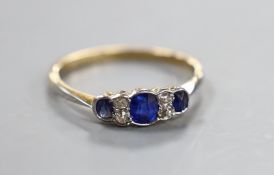 A 1920's 18ct and plat, three stone sapphire and four stone diamond chip set ring, size O, gross