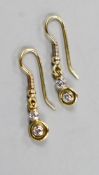 A pair of yellow metal and two stone diamond set drop earrings, overall 25mm, gross weight 2.1