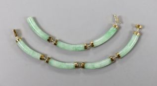 A modern Chinese 14k yellow metal and curved jade link bracelet (a.f.), approx. 20cm, gross 13.7