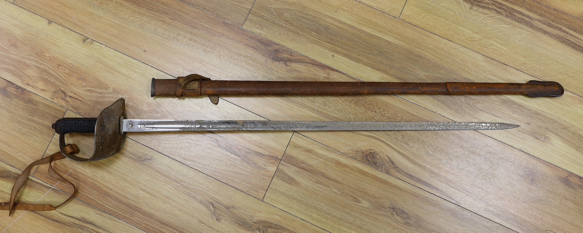 A George V military dress sword in brown leather covered scabbard, 102cm long, and a Middle - Image 4 of 10