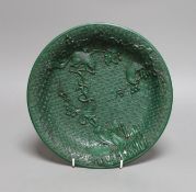 A Chinese green lacquer dish, 24.5cms diameter,
