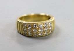 A yellow metal and eighteen stone pave set diamond ring, size Q/R, gross weight 10.7 grams.