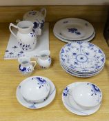 A collection of varying patterns of Royal Copenhagen blue and white tableware,