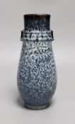 A Chinese Shiwan vase, 23 cms high,