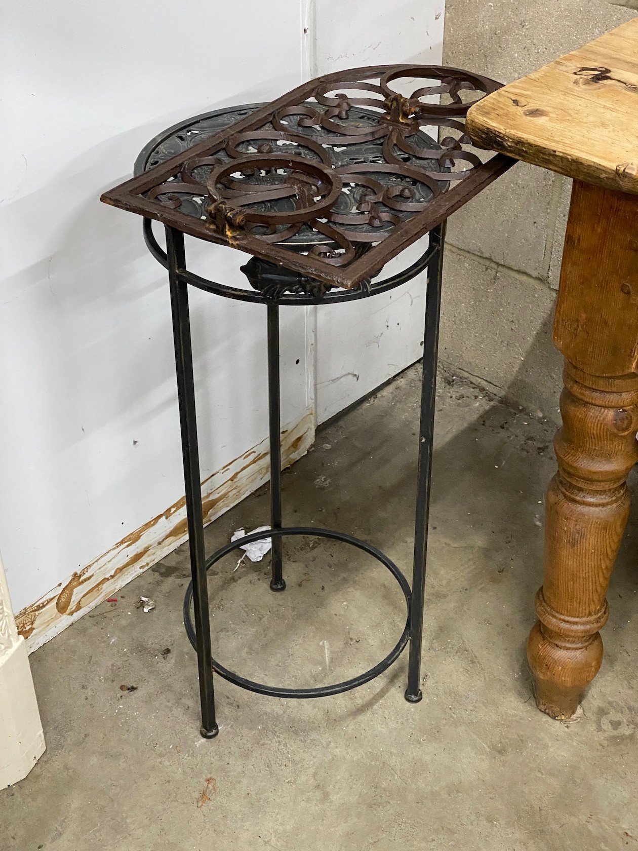 Three metal hanging baskets, a wall mounted pot holder and a stand