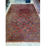 A Bokhara red ground carpet, 310 x 200cm