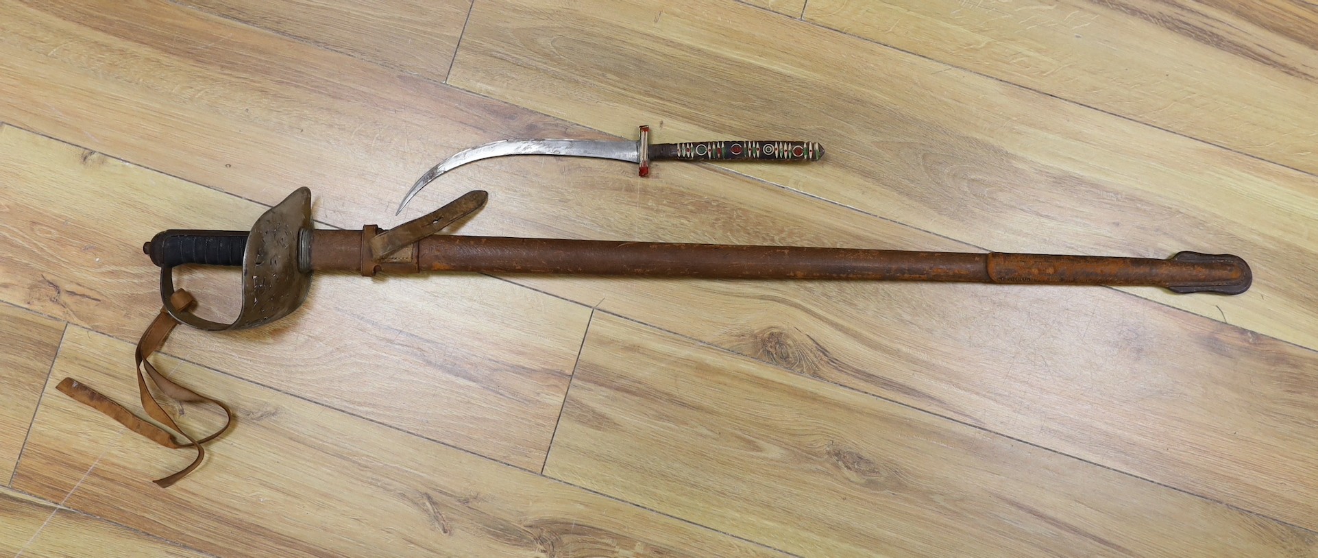 A George V military dress sword in brown leather covered scabbard, 102cm long, and a Middle