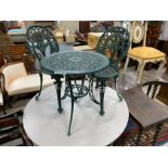 A Victorian style aluminium garden table, diameter 60cm, height 62cm and two chairs