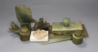 A Chinese bowenite jade desk set (7) and a plaque,model of junk 16cms high,