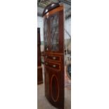 A large Regency mahogany bowfront standing corner cabinet, width 88cm, depth 47cm, height 246cm