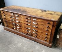 A large Victorian oak geological specimen cabinet, fitted 18 drawers with side locking bars, width
