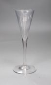 An 18th century toasting glass, 19cms high,