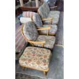 An Ercol beech three piece lounge suite and footstool, settee length 174cm, width 80cm, height 82cm