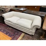 A late Victorian Howard style Chesterfield settee upholstered in natural fabric, length 190cm, depth