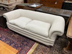 A late Victorian Howard style Chesterfield settee upholstered in natural fabric, length 190cm, depth