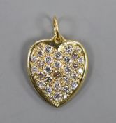 A modern 18ct gold and pave set diamond heart shaped pendant, overall 27mm, gross weight 11.3