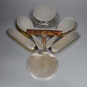 A 1960's seven piece engine turned silver backed brush, mirror and powder bowl set.