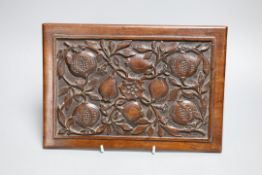 An Aesthetic period carved walnut ‘pomegranates’ panel, 28 cms wide x 19 high,