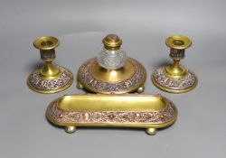 A brass and filigree worked copper desk set (4),inkwell 10.5 cms high,