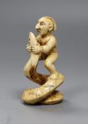 A 19th century native American marine ivory group of a warrior wrestling a snake, 7cm high,