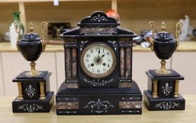 A black slate and marble clock garniture,clock 33cms high,