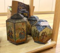 Four Japanned metal tea cannisters and a cased dressing set