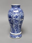 A Chinese blue and white vase, Kangxi period,23 cms high,