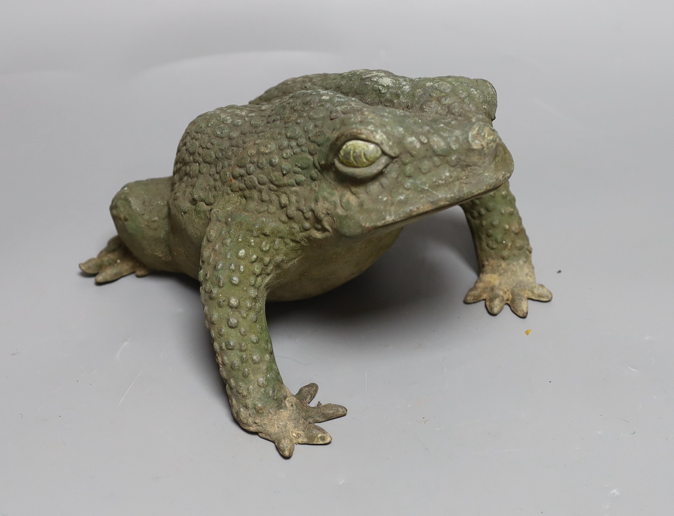 A Japanese bronze model of a toad, 25cms long,
