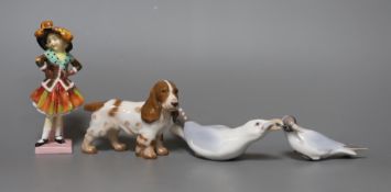 A Royal Doulton figure,”Party Girl”, HN 2036, two Bing and Grondahl birds and a dog,figure 14 cms