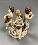 A Meissen group of four putti musicians, late 19th century, 11 cm high, losses