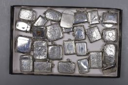 A collection of twenty six mainly early 20th century silver vesta cases and one combination vesta/