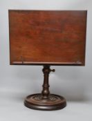A 19th century turned mahogany book/ music stand,49 cms high,
