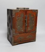 A Chinese brass mounted two door, five drawer cabinet,29 cms high,