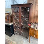 A George III mahogany bookcase, width 116cm, depth 39cm, height 199cm