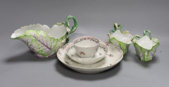 A Longton Hall cabbage leaf sauceboat and two similar creamboats, c.1755, faults and Newhall type