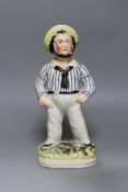 A Staffordshire pottery figure of a sailor, 33 cms high,