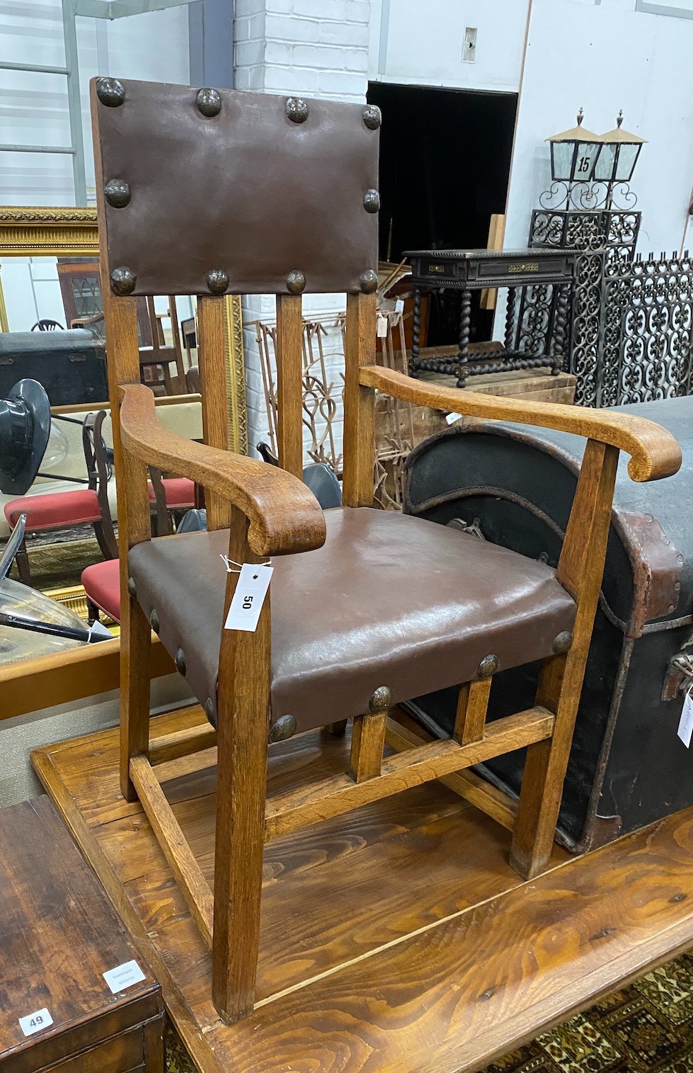 A pair of Arts & Crafts oak elbow chairs, width 58cm, depth 49cm, height 97cm