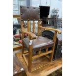 A pair of Arts & Crafts oak elbow chairs, width 58cm, depth 49cm, height 97cm